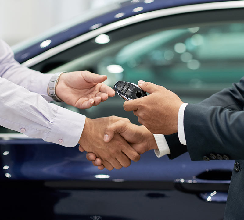 hand with car keys